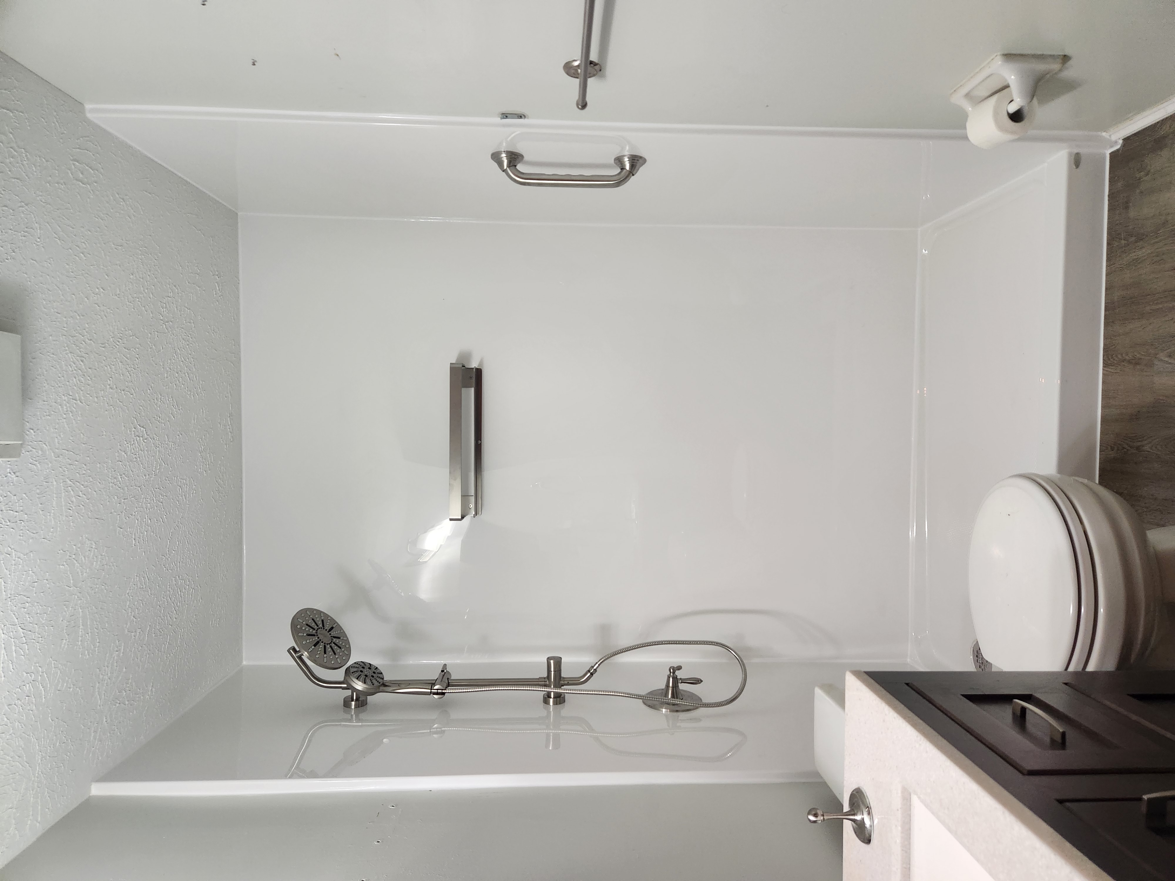 Walk-in shower with grab bars